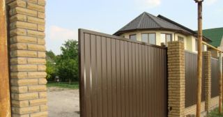 Купить откатные ворота из профнастила Октябрьский, цена от 1788 руб.